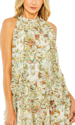 A woman wearing the Mac Duggal 8489 Midi Party Dress, a sleeveless floral dress with a high-neck design and micro ruffle detailing, crafted from sheer pastel fabric and featuring a delicate high-low hemline.