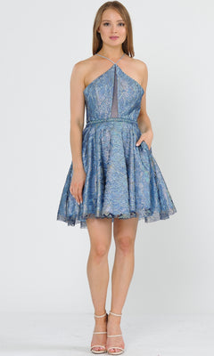 A woman faces forward wearing the Glitter-Mesh Short A-Line Homecoming Dress 8506, a sleeveless blue patterned dress with a halter neckline and flared skirt, paired with strappy heels.