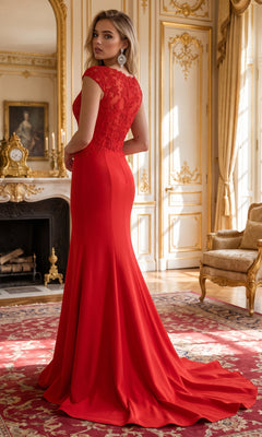 A woman wearing the Cap-Sleeve Embroidered Jersey Long Prom Dress 8558 stands in an ornate, gold-accented room with large windows, a fireplace, and elegant furnishings.