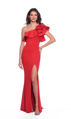 A woman poses against a white backdrop in the Long Formal Dress A8568 by Dave and Johnny, featuring a red, one-shoulder design with a ruffle bodice, thigh-high slit, and elegantly fitted floor-length silhouette.
