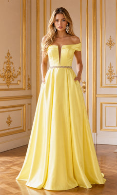 A woman wearing the Plunging V-Neck Long Mikado Prom Ball Gown 8680 in yellow, featuring an off-the-shoulder design and a floor-length silhouette, stands in an ornate room with gold-trimmed walls and wooden floors.