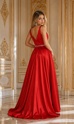A woman wearing the Deep V-Neck Long Mikado A-Line Prom Dress 8682, featuring a jeweled belt and crafted from luxurious red Mikado fabric, stands in an opulent room with ornate gold and white paneling, glancing over her shoulder.