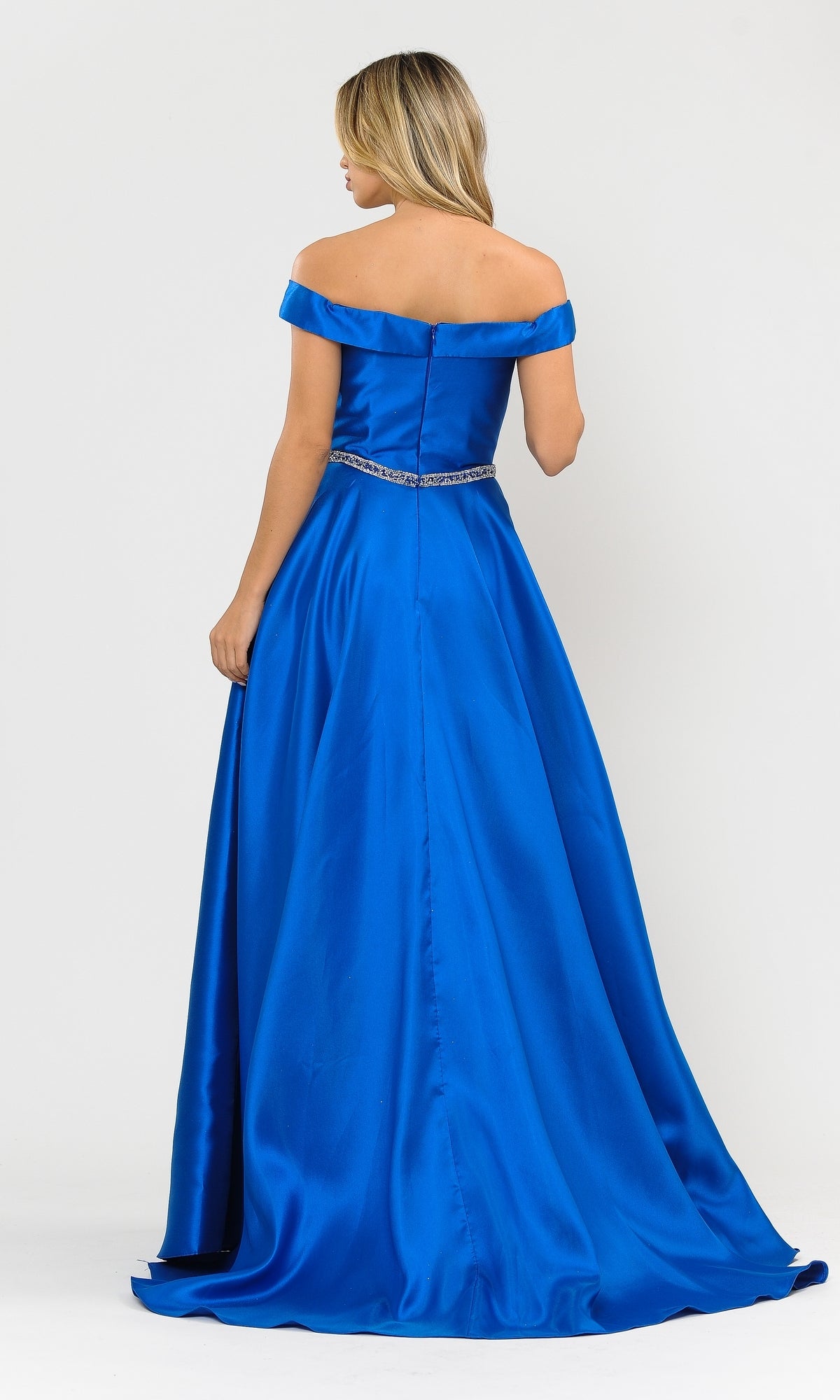 A woman faces away, wearing the Off-the-Shoulder Long Prom Gown with Pockets 8686 in royal blue Mikado fabric with a jeweled belt, set against a plain white background.