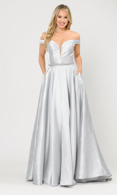 A woman models the Off-the-Shoulder Long Prom Gown with Pockets 8686—a silver, floor-length satin dress featuring a fitted waist and pockets—against a plain light background.