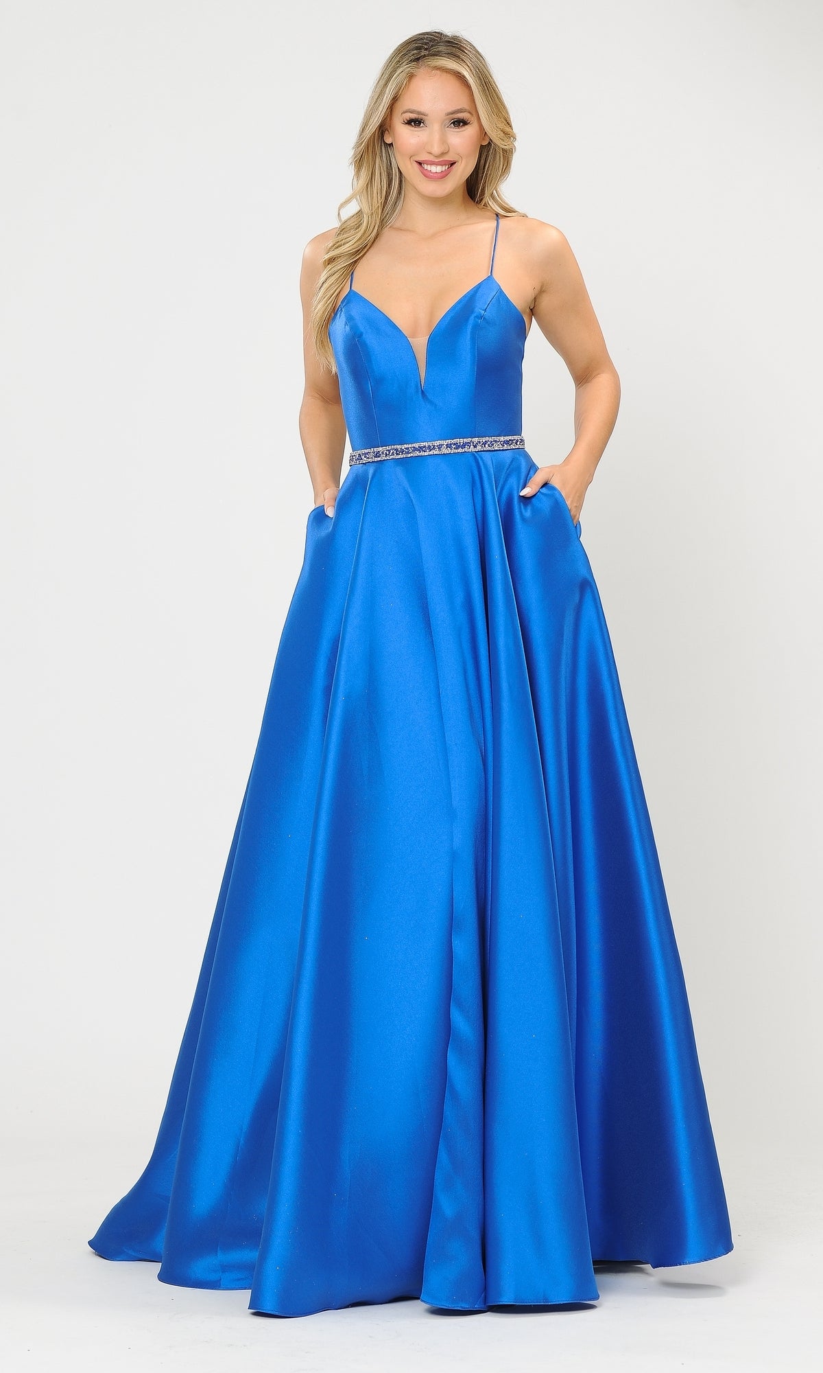 A woman wears the Strappy-Back Long Mikado A-Line Prom Dress 8688, a vibrant blue, floor-length gown with thin straps and a plunging neckline, standing against a plain white background.