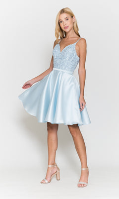 Woman wearing the Short A-Line Homecoming Dress with Pockets 8694, featuring a beaded v-neck bodice and flared skirt, posing against a white background.