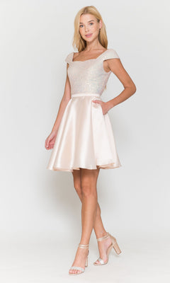 A woman in the Cap-Sleeve Short A-Line Homecoming Dress 8732, featuring light pink sequins and a satin fit-and-flare skirt, stands in heels against a plain white background.
