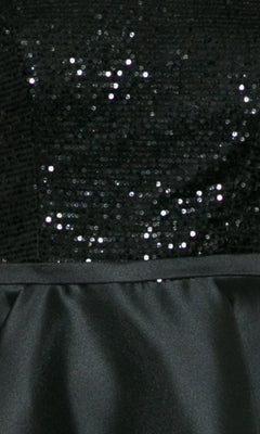 Close-up of the Cap-Sleeve Short A-Line Homecoming Dress 8732, featuring a black sequined bodice and sleek satin-like skirt—an ideal choice for your next party or homecoming.