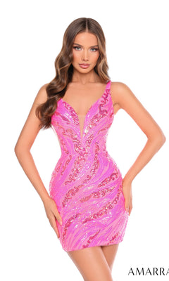 A woman poses with hands on hips against a white background, wearing the Amarra 88074 Sheer-Sides Mini Sequin Hoco Dress—a sleeveless, pink, form-fitting bodycon dress with a deep V neckline.