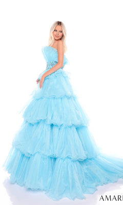 A woman poses in the Long Formal Dress 88083 by Amarra, featuring a strapless fitted bodice, beaded waist, and ruffled layers, set against a white background.