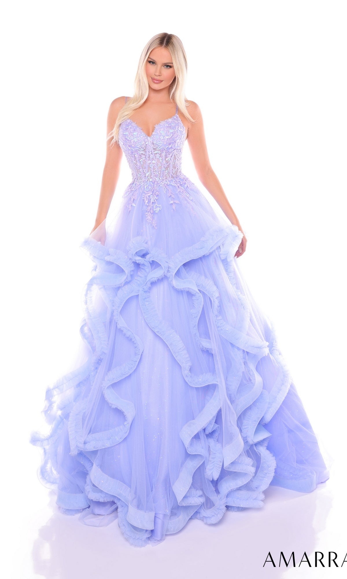 A woman poses against a white background wearing the Amarra 88094 Ruffle Formal Ball Gown, featuring a strapless lavender embroidered corset bodice and ruffled layers.