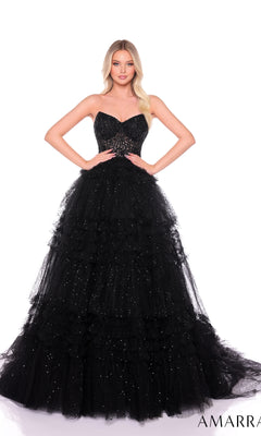 A woman stands against a white background wearing the Long Formal Dress 88099 by Amarra, featuring a strapless design with a fitted sheer corset bodice and a ruffle layered tulle skirt.