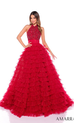 A woman wears the Long Formal Dress 88102 by Amarra, a sleeveless red A-line gown featuring a beaded bodice and ruffle layered tulle skirt, standing against a white background.