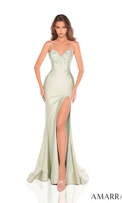 A woman models the Amarra 88235 Long Prom Dress—a light green, floor-length gown with thin straps, floral embroidery, a high slit, and a strappy open back—against a white background.