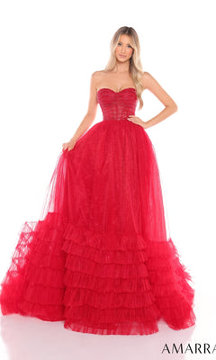 A woman stands against a white background wearing the Strapless Prom Ball Gown: Amarra 88277, featuring a sweetheart neckline, tulle fabric, and an elegant floor-length a-line ruffled skirt.