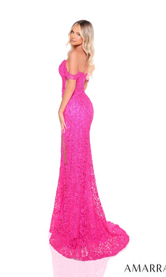 A woman with long blonde hair wears the Amarra 88372, an off-the-shoulder, floor-length prom dress with bright pink floral lace embroidery and a slit, posing against a white background.