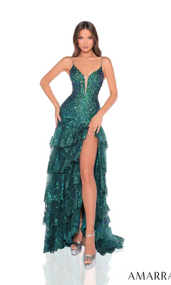 A woman models the Amarra Long Formal Dress 88500, a sparkly emerald green gown with ruffle layers, a plunging V-neckline, tiered skirt, thigh-high slit, and silver heels against a white background.
