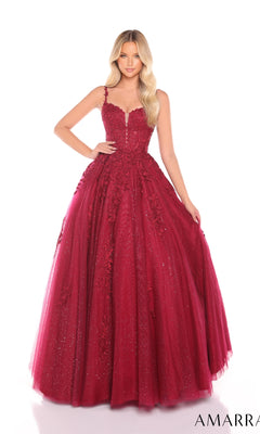 A woman stands against a white background wearing the Floral Lace Prom Ball Gown: Amarra 88590, a sleeveless burgundy tulle dress with a fitted bodice, full skirt, subtle glitter details, and embellished floral lace.