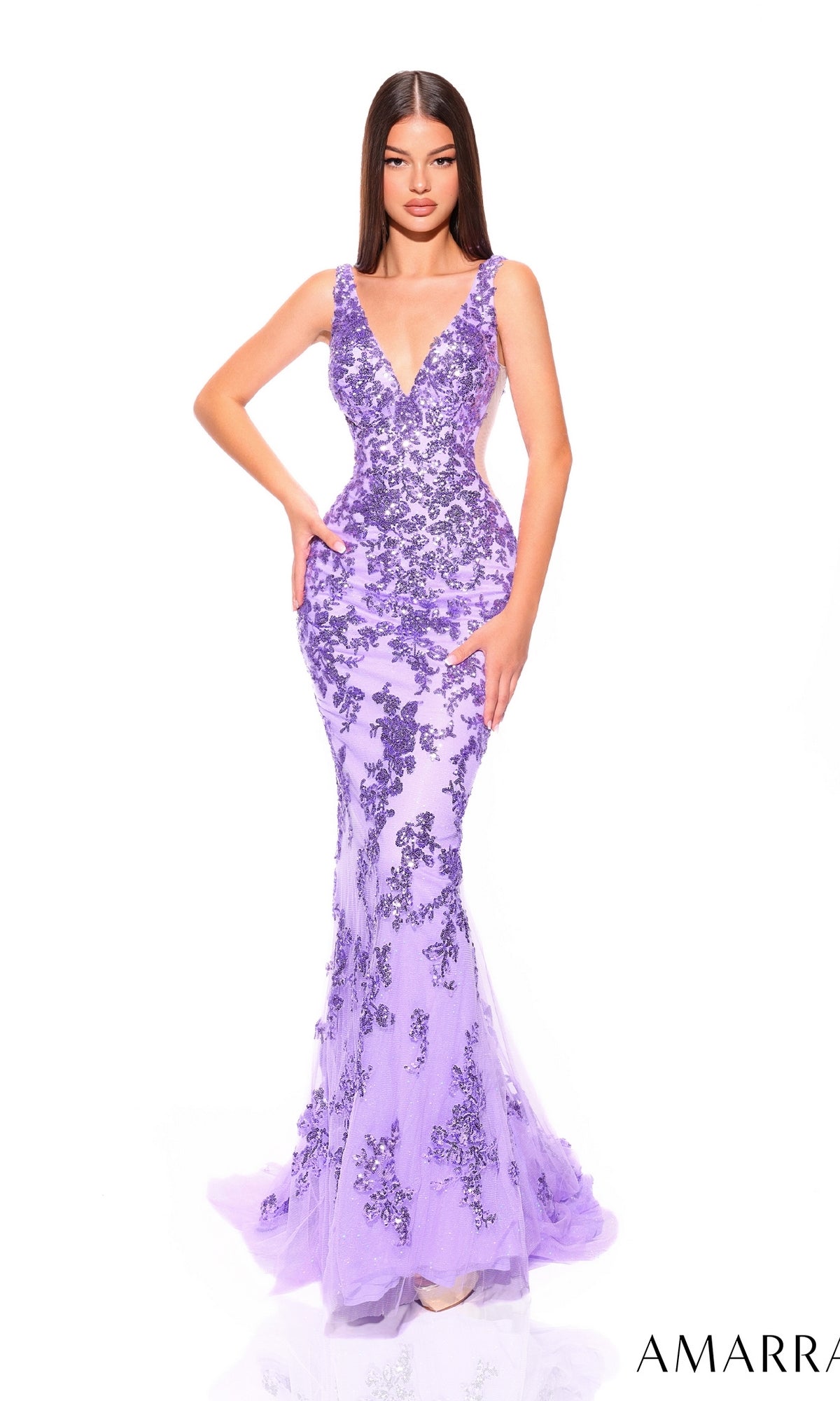 A woman wears the Sheer-Sides Long Sequin Mermaid Prom Dress 88832, a fitted, floor-length gown with sparkling sequins and sheer side panels; she stands against a plain white background.
