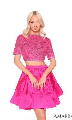 A woman models the Amarra 88902, a bright pink short two-piece party dress with an embellished bodice and matching high-waisted A-line skirt, standing against a white background.