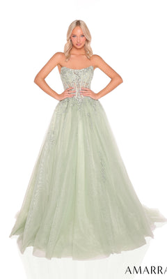 A woman stands against a white background wearing the Amarra 88913 Strapless Long Prom Ball Gown in light green, featuring a fitted embellished bodice and a full tulle skirt.