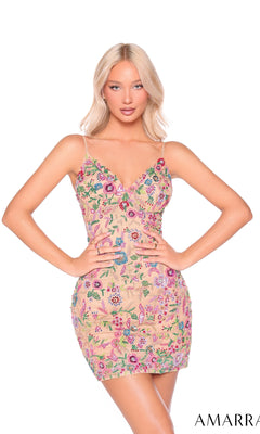 A woman wears the Amarra 88918, a short beaded floral Hoco dress with thin straps and colorful embroidered patterns, standing against a plain white background.