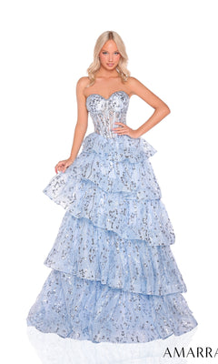 A woman poses in the Strapless Long Ruffled Prom Dress: Amarra 88934, a light blue gown with tiers, silver embellishments, and a fitted bodice.