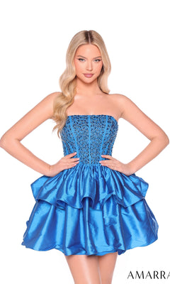 A woman poses in the Amarra 88952 Strapless Short Tiered Hoco Dress, featuring a beaded corset-style bodice and ruffled mini skirt, against a white background.