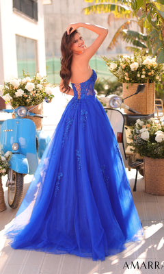 A woman in the Amarra 89011 Lace-Up Strapless Prom Ball Gown with a sweetheart bodice stands outdoors near blue scooters and flower arrangements.