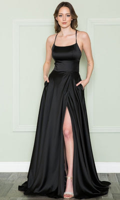A woman models the Lace-Up Corset-Back Long A-Line Prom Dress 8910, a sleek black satin gown with spaghetti straps and a high slit, standing by a light green wall with white trim.