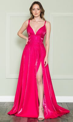 A woman indoors wears the Long Beaded A-Line Prom Dress by Poly USA 8922 in hot pink, featuring a sleeveless design, lace-up back, deep V-neckline, thigh-high slit, and strappy heels.