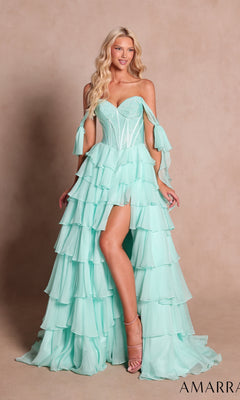 A woman stands against a plain beige background wearing the Amarra 89285 Long Prom Dress in mint—a strapless, ruffled gown featuring a tiered chiffon A-line skirt, an embellished corset bodice, and detached sleeves.