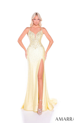 A woman wears the Amarra 89381 long prom dress in light yellow, featuring rhinestone embellishments, spaghetti straps, and a thigh-high slit, standing against a white background.