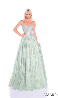A woman stands against a white background wearing the Amarra 89415 long prom dress, featuring a strapless light green fitted bodice, an A-line tulle skirt, and glittering hot-stone embellishments.