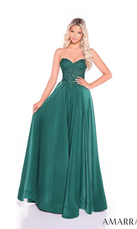 A woman models the Amarra 89433 long prom dress, featuring a strapless, fitted beaded bodice and flowing satin A-line skirt in emerald green—a floor-length gown perfect for any formal occasion, shown against a white background.