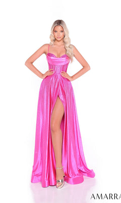 A woman models the Amarra 89522, a bright pink, floor-length satin prom dress with a high slit, spaghetti straps, and metallic sheen. She pairs it with silver heels and has long, wavy blonde hair.