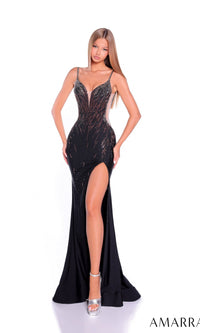A woman poses in the black Amarra 89529 long prom dress, featuring a beaded bodice, high-leg slit, sheer side panels, and silver embellishments. She completes the look with silver platform heels against a white background.