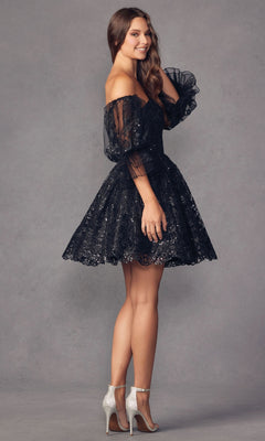 A woman models the Puff-Sleeve Short Strapless A-Line Prom Dress 895 with removable puff sleeves and sheer black lace, smiling over her shoulder in silver heels against a gray backdrop.