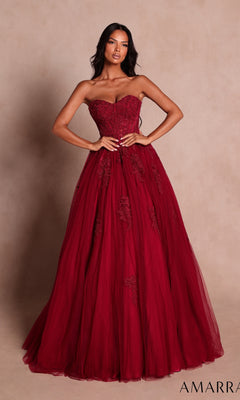 A woman wearing the Amarra 89627 Long Prom Dress in wine—a strapless, floor-length gown featuring beaded floral lace detailing—stands against a neutral background.