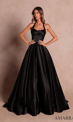 A woman wearing the Amarra 89646 long black prom dress, featuring a fitted bodice and halter neckline, poses against a neutral background.