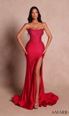 A woman stands against a neutral background wearing the Amarra 89655, a long red prom dress featuring a strapless fitted silhouette with beaded embellishments and a high slit.