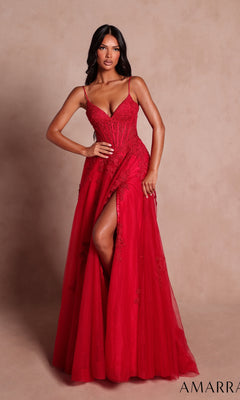 A woman stands against a beige background wearing the Amarra 89693 long red prom dress, featuring a sleeveless design, boned-corset bodice, floor-length silhouette, and a thigh-high slit.