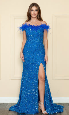 A woman poses in the blue Sequin-Velvet Long Feathered Prom Dress 8980, featuring an off-shoulder neckline, feather trim, and a thigh-high slit, paired with silver heels against a beige wall.