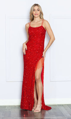 A woman wearing the Strappy-Back Fringed Long Sequin Prom Dress 8982 in red, featuring thin straps and a thigh-high slit, stands against a white wall with nude heeled sandals.