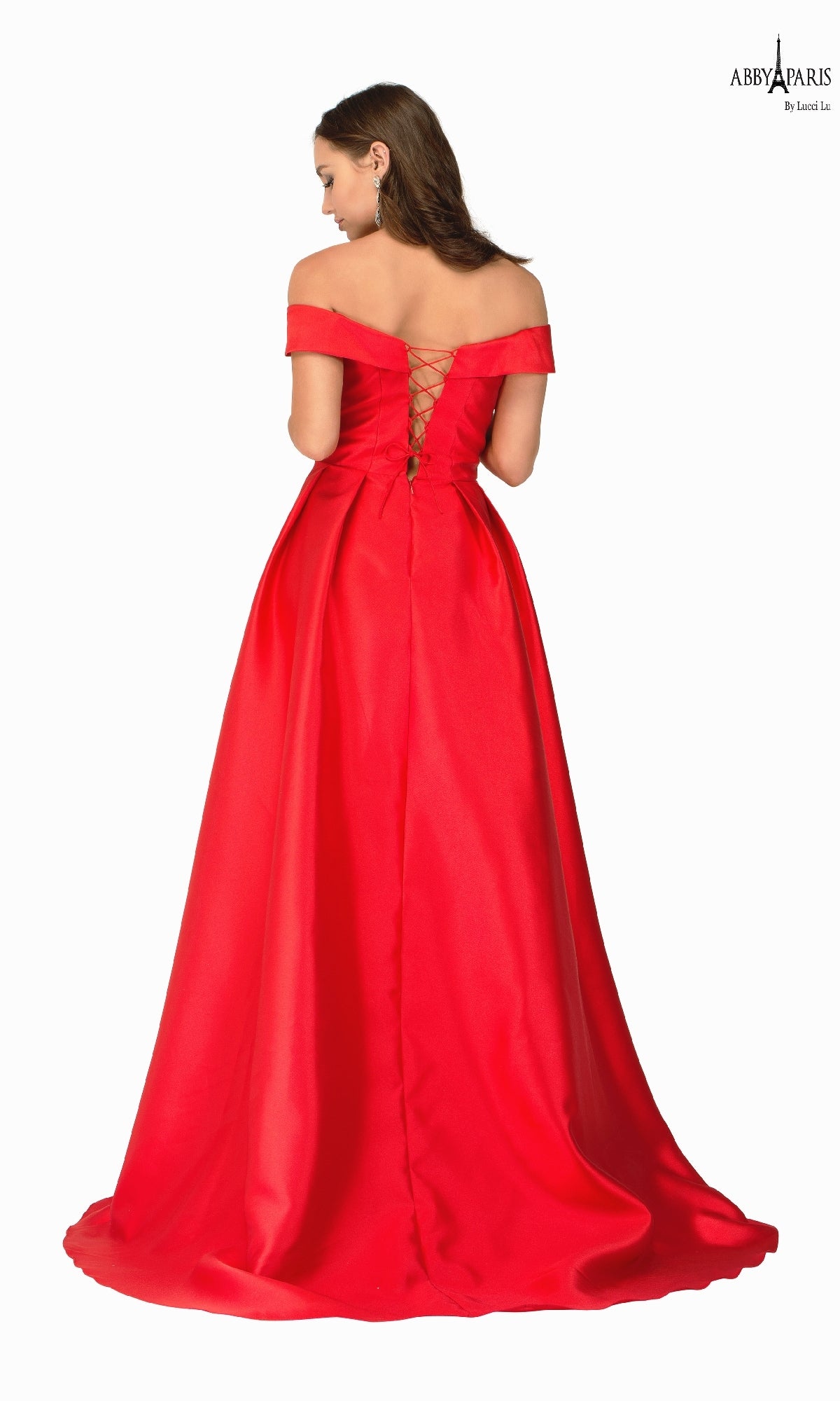 A woman faces away, wearing the Classic Mikado Prom Ball Gown Abby Paris 90023—a floor-length, off-the-shoulder dress with a lace-up back.