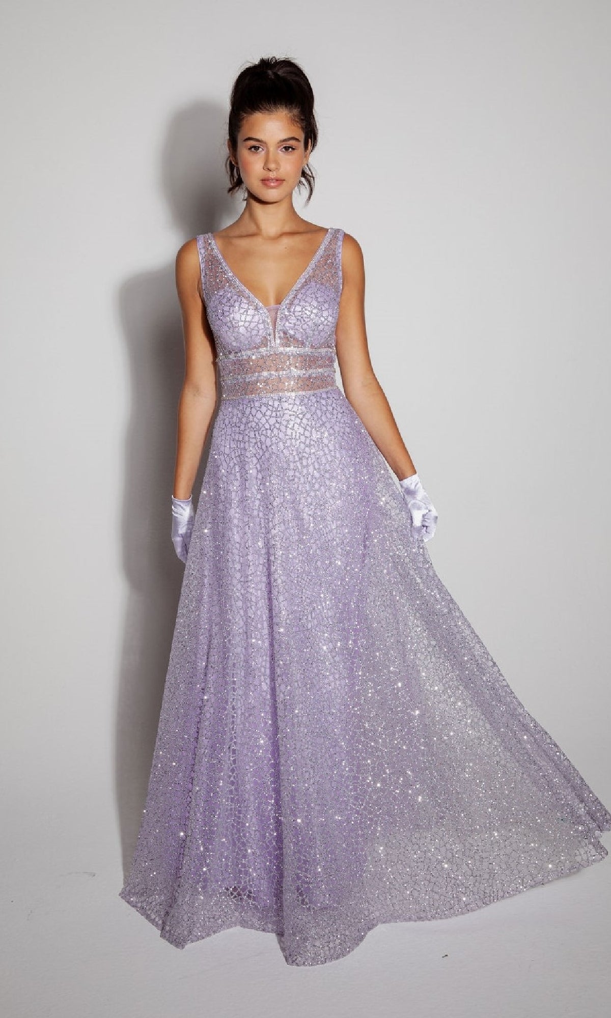 A woman poses against a plain background in the sleeveless, floor-length Eureka 9005 Glitter Formal Dress in lavender with a deep V neckline and white gloves.