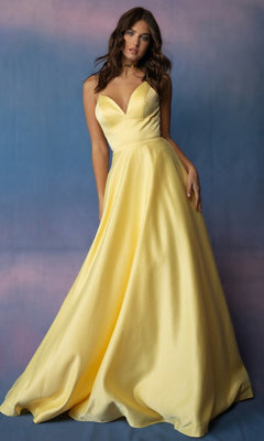 A woman wearing a yellow Eureka 9008 Strappy-Back Long Satin Prom Dress featuring a floor-length V-neck, spaghetti straps, and an open back.