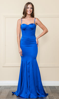 A woman stands indoors wearing the Long Sweetheart Mermaid Corset Prom Dress 9008 in royal—a fitted, mermaid-style gown with spaghetti straps, a structured bodice, and crafted from luxurious stretch charmeuse.