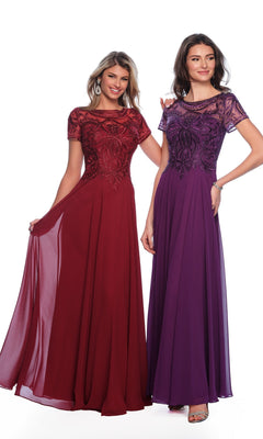 Two women wear the Dave & Johnny A9071 short sleeve formal dress—one in burgundy, one in purple. The lace bodice A-line gowns look elegant as they stand smiling against a white background.