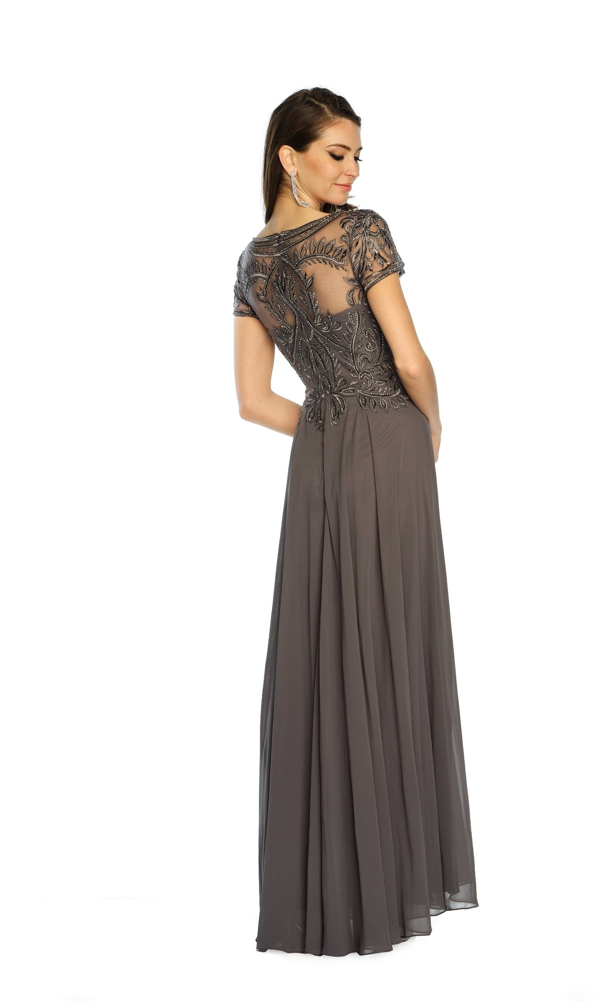 A woman poses against a white background wearing the Dave & Johnny A9071 short sleeve formal dress, a charcoal floor-length A-line gown featuring sheer beaded detailing on the upper back.